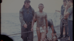 Saipan: NPC-17614 - Rescued Japanes; shelling vessel, firing 5" guns at shore, scenic shot